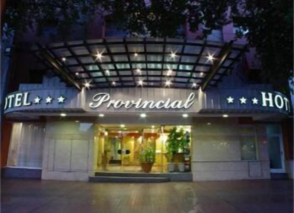 Hotel entrance with a marquee sign reading Provincial Hotel